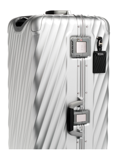 Valise Trunk XL 87 cm TUMI 19 Degree Aluminium Silver, détail des serrures et de la poignée latérale