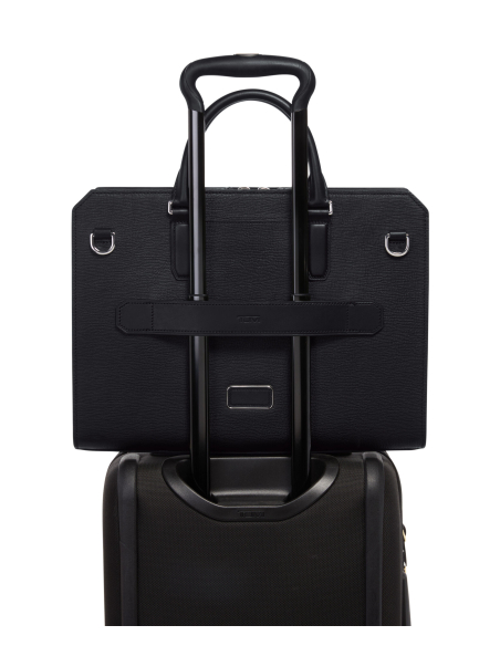 Porte-documents Savona TUMI Turin Black, passant installé sur une valise