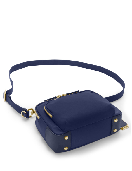 Sac bandoulière Teghan nylon TUMI Indigo/Light Gold, base avec pieds métalliques