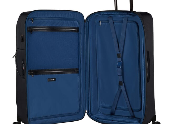Int&eacute;rieur bleu d&rsquo;une valise Samsonite Splendix ouverte, avec s&eacute;parateurs, poches et sangles.