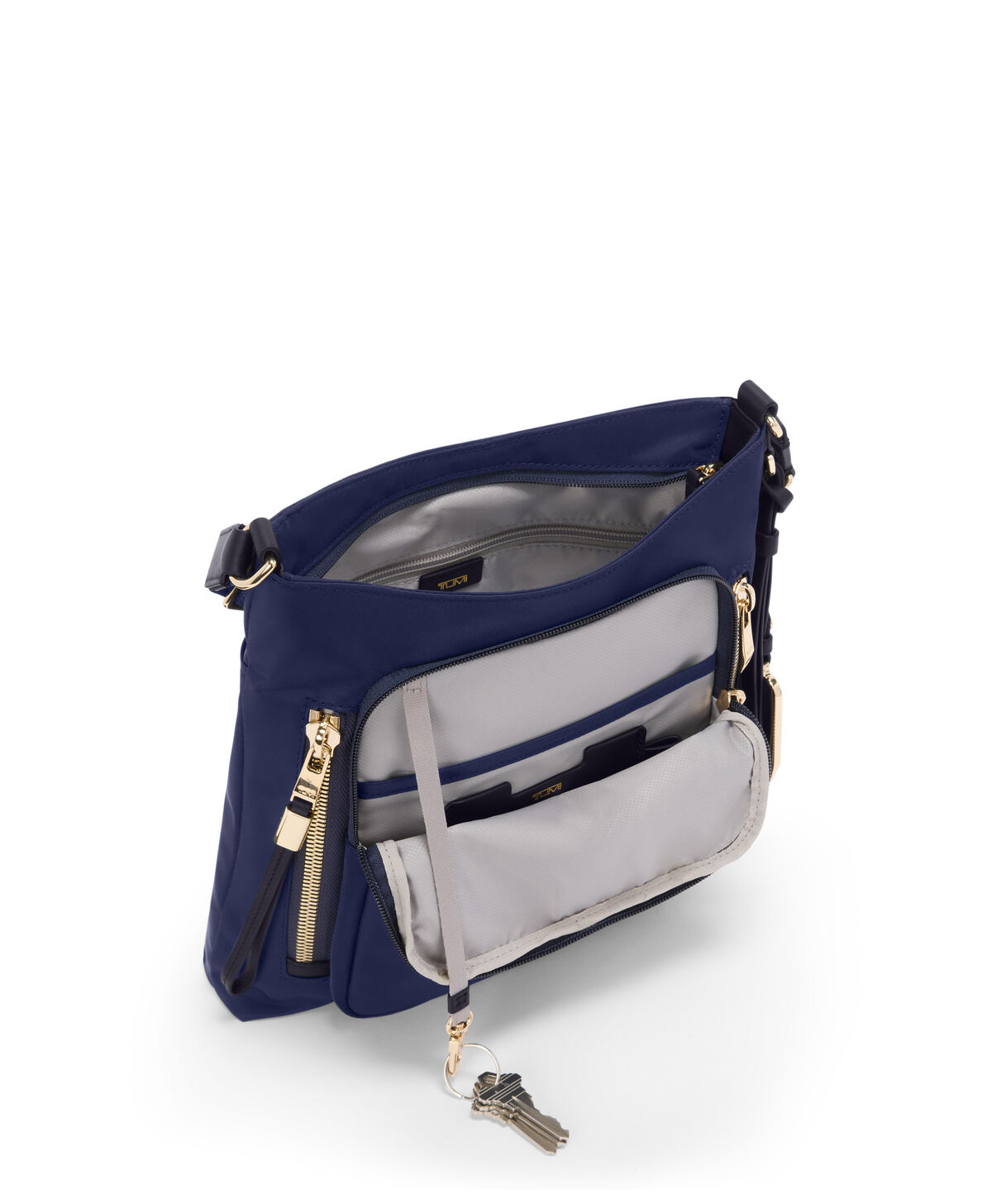 Poches du sac bandouli&egrave;re TUMI Voyageur Tyler Indigo/Light Gold
